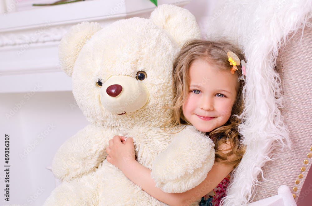 little cute girl with big white teddy bear