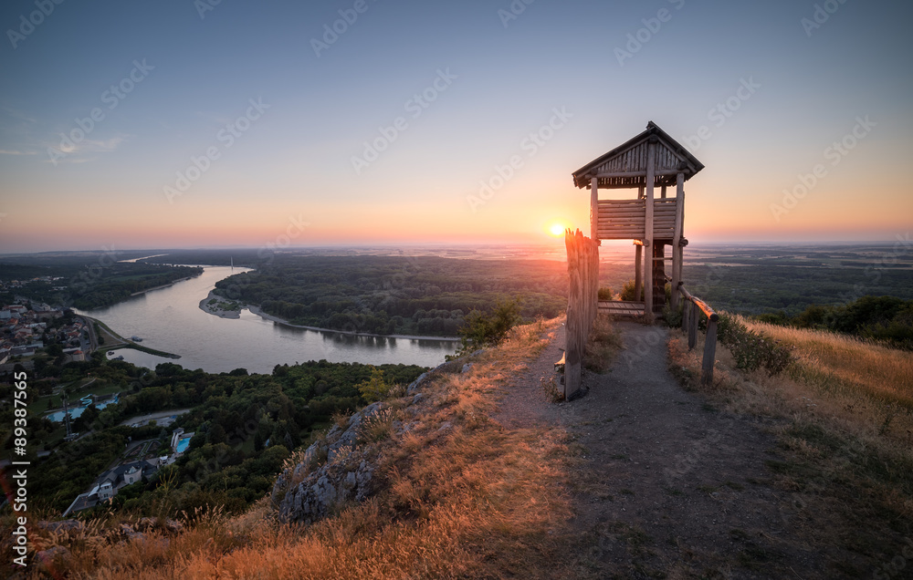 Wooden Tourist Observation Tower above a Little City with River Wooden Tourist Observation Tower above a Little City with River