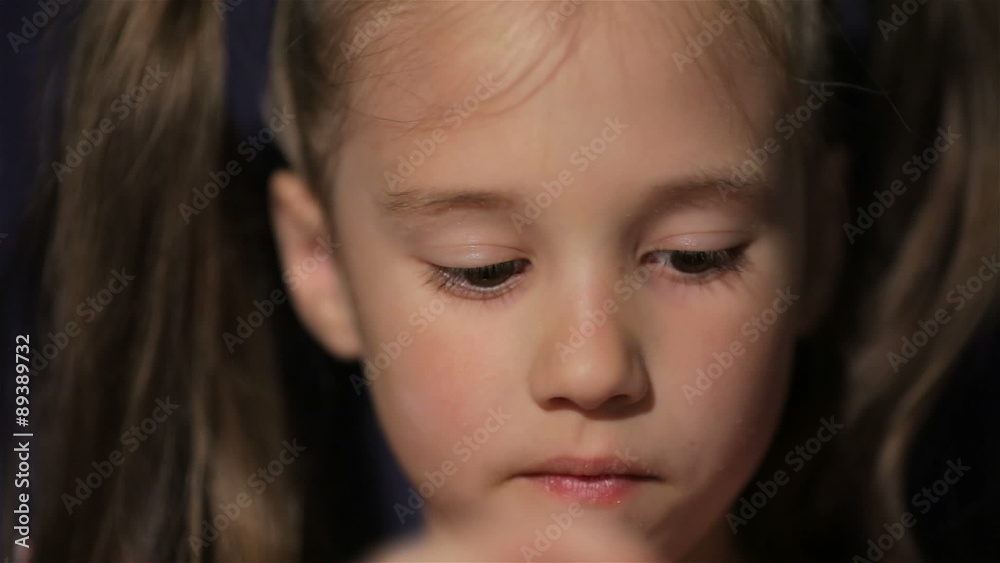 Beautiful little girl waching movie in the cinema Beautiful little girl waching movie in the cinema