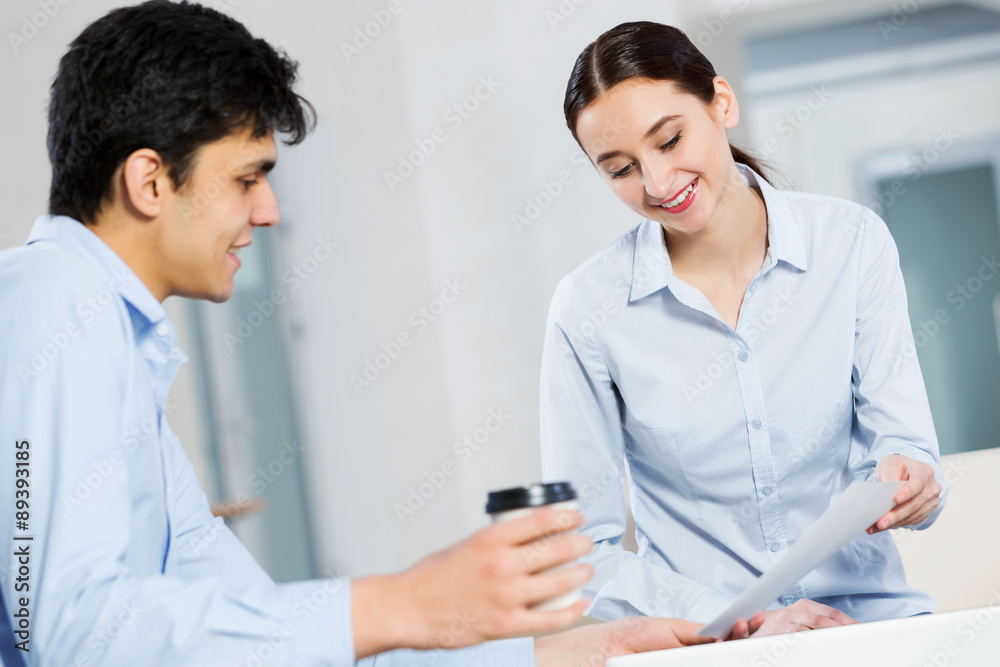 Fototapeta premium Two young people working as partners