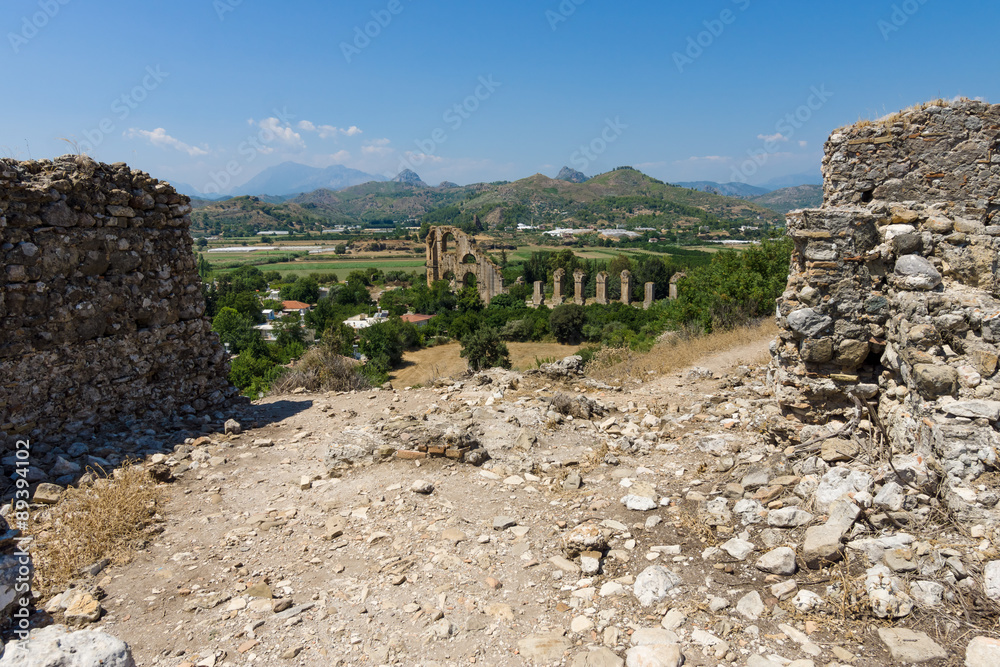 Ancient ruins of Aspendos. In the background the aqueduct. Turkey.