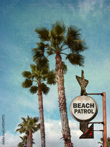 aged and worn vintage photo of beach patrol sign