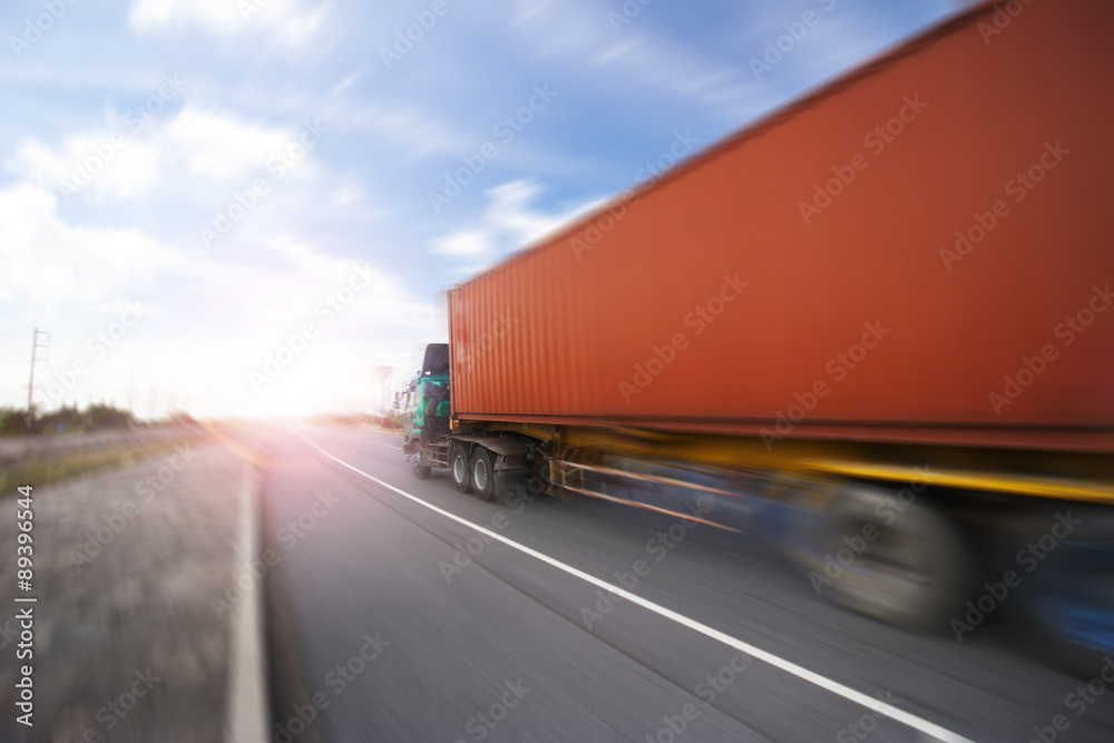 Generic big trucks speeding on the highway at sunset - Transport industry concept , big truck containers