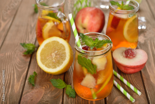 Ice tea with lemon, peach and mint