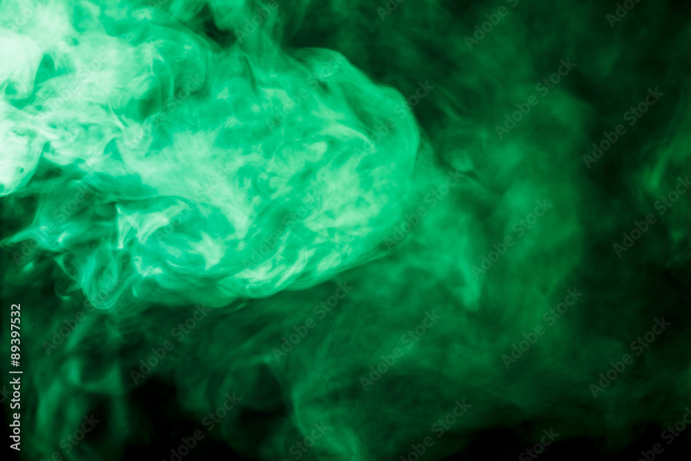 Abstract green smoke hookah on a black background. Stock Photo | Adobe