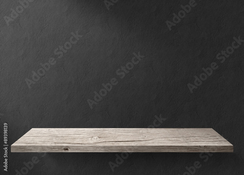Wood table with dark wall background