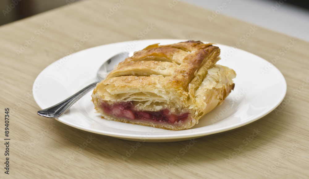 Freshly baked apple and berry strudel