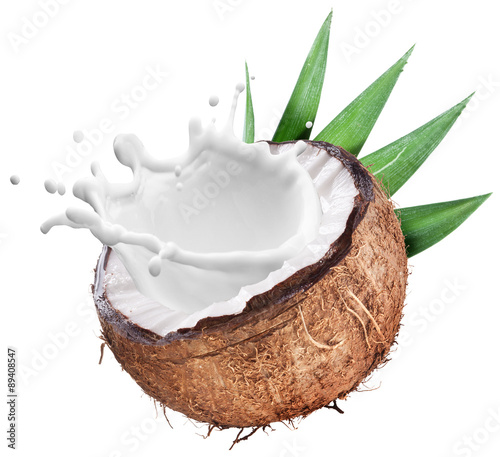 Fototapet Coconut with milk splash inside.