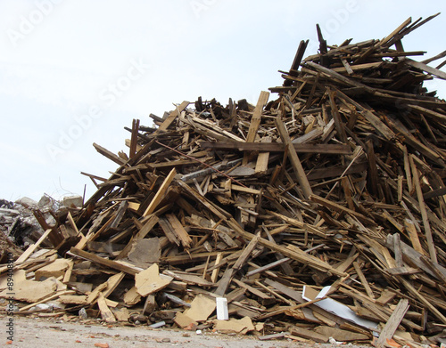 large pile of wood on a demolition site