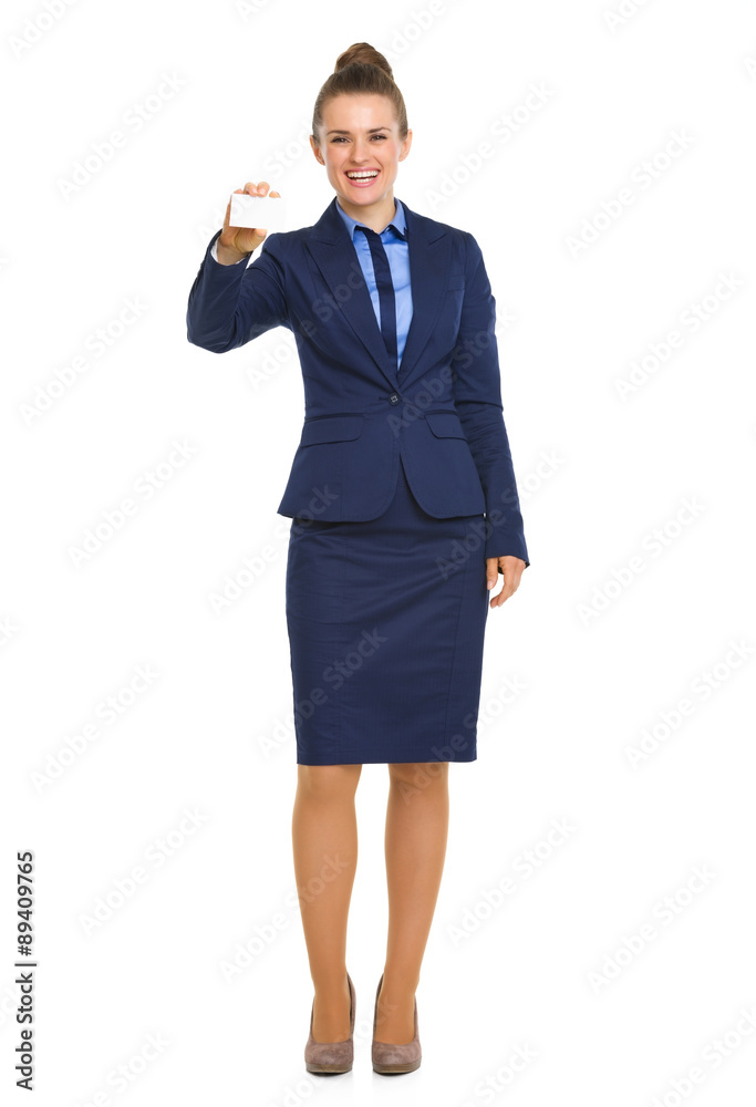 Smiling businesswoman in blue suit holding up business card Smiling businesswoman in blue suit holding up business card
