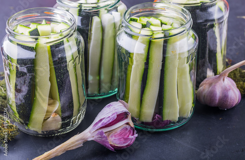 Marinated zucchini pieces in jars
