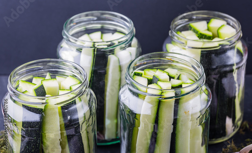 Marinated zucchini pieces in jars