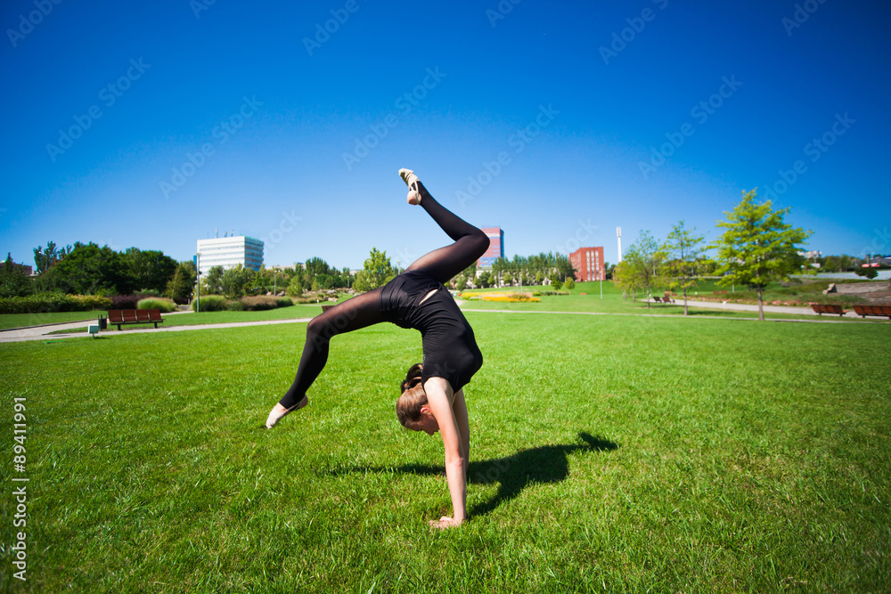Young gymnast on grass in sunny day Young gymnast on grass in sunny day