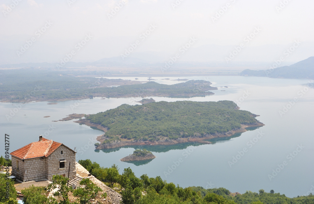 Fototapeta premium Summer view of the Slansko Lake with islands near Niksic town, Montenegro