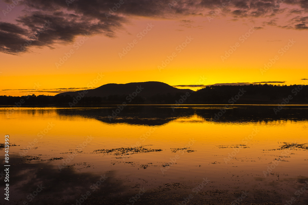 Beautifully rich coloured sunrise at Lake Moogerah in Queensland, Australia