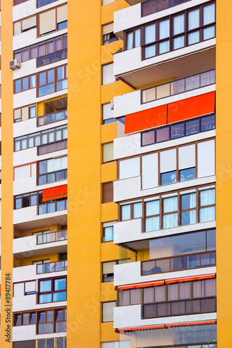 modern buildings with balconies and terraces in yellow