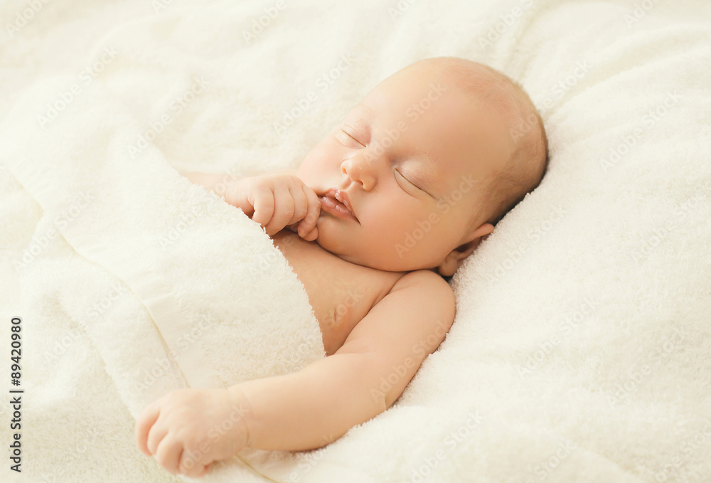 Portrait of cute baby sleeping on the bed at home Portrait of cute baby sleeping on the bed at home