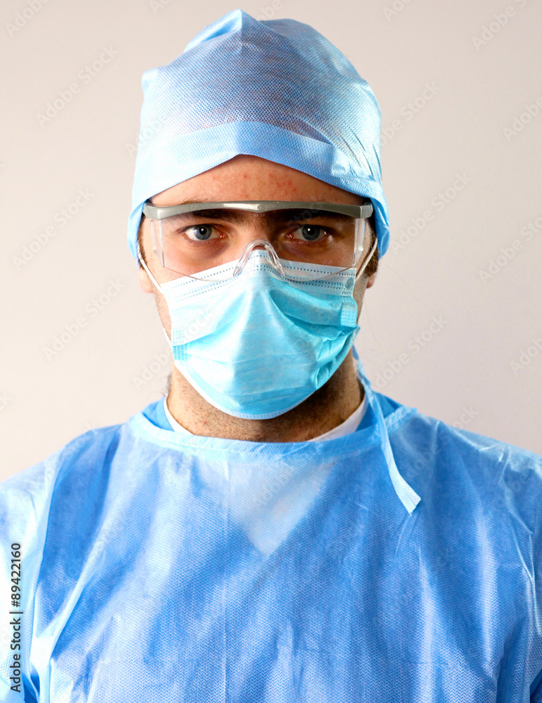 Man surgeon holds a scalpel in an operating room Man surgeon holds a scalpel in an operating room