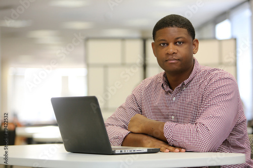 Office Space, Young African American Male Professional with laptop