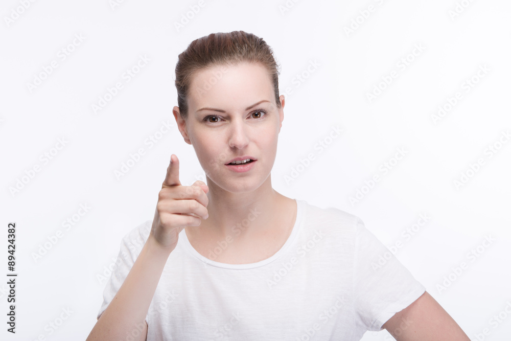 Junge hübsche Frau hält den Zeigefinger hoch - Aufpassen Junge hübsche Frau hält den Zeigefinger hoch - Aufpassen