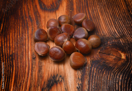 Chestnuts on wooden background