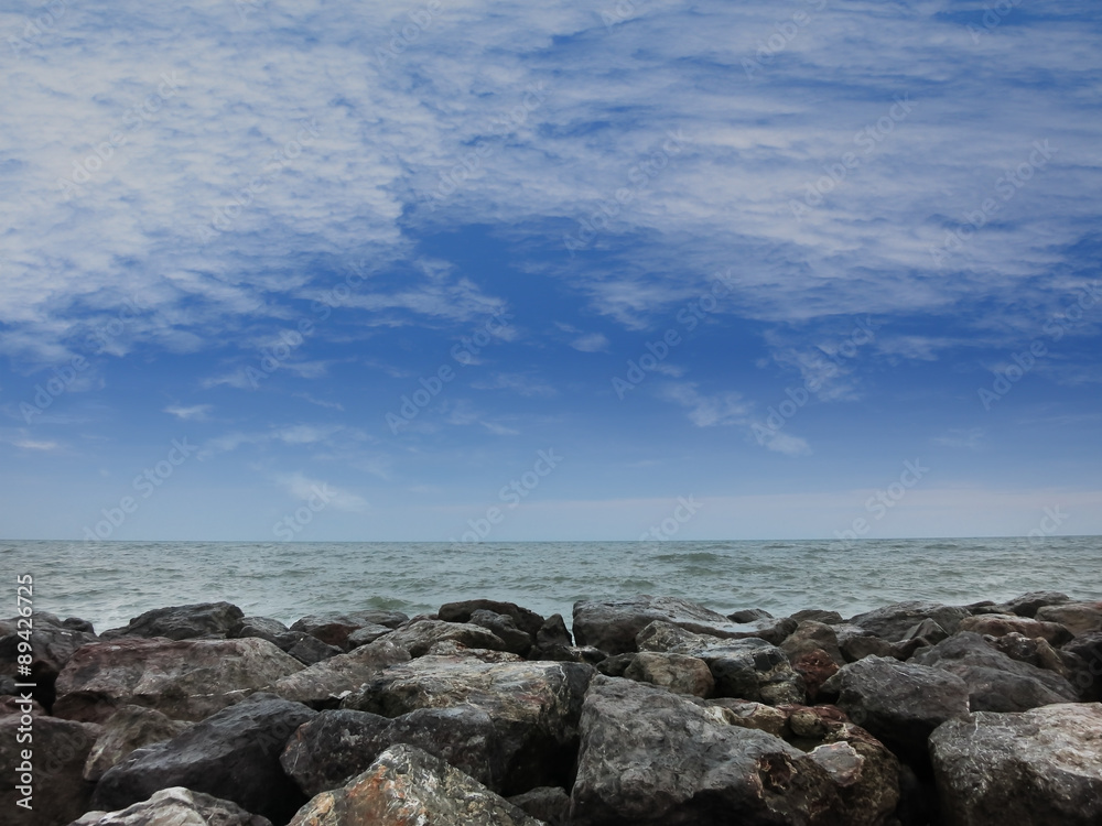 Stones on the beach under blue sky