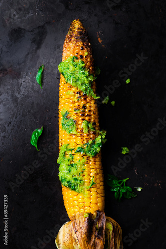 corn a grill with pesto sauce on © zoryanchik