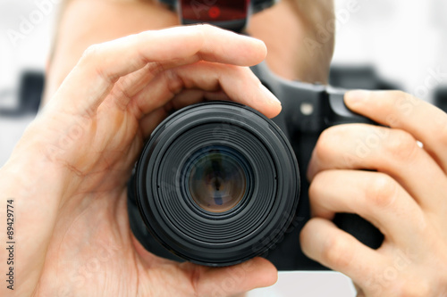 front view of man holding camera © ronstik