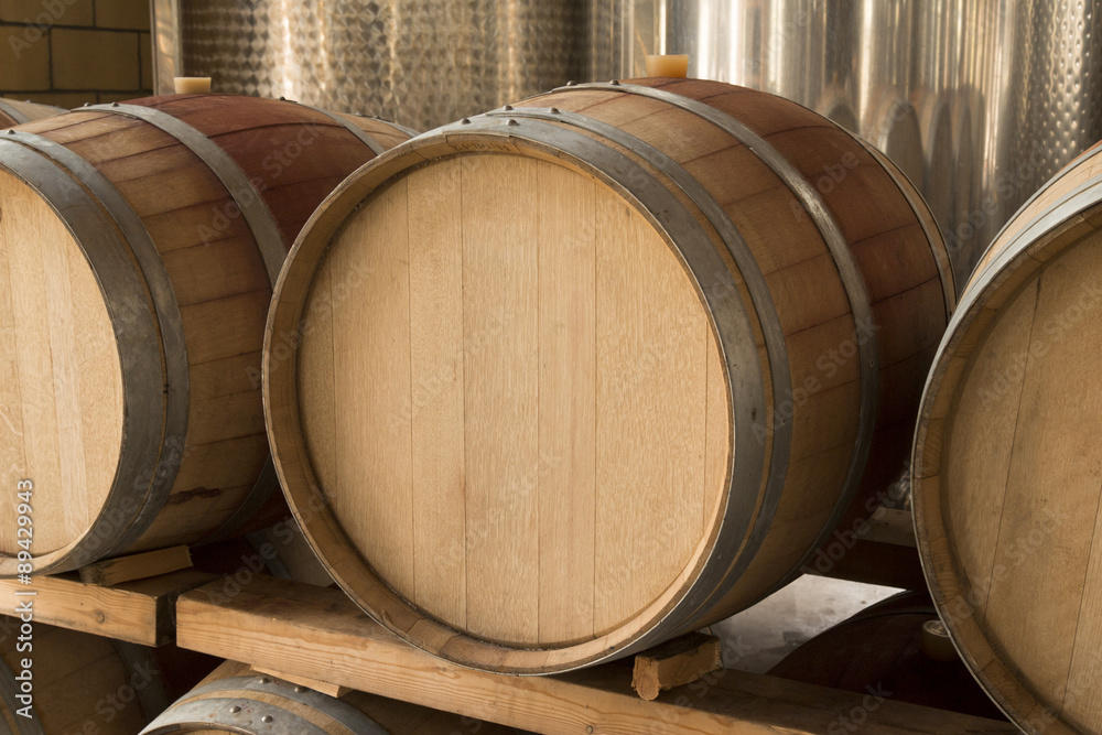 Close up of wooden wine barrel in wine cellar 