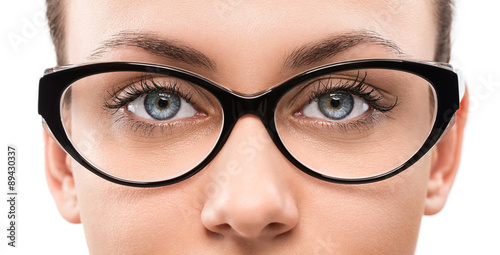 Valokuva Cloese up of young woman wearing eyeglasses isolated on white ba