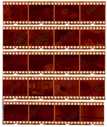 Realistic gritty scan of 35mm color negative film strips.