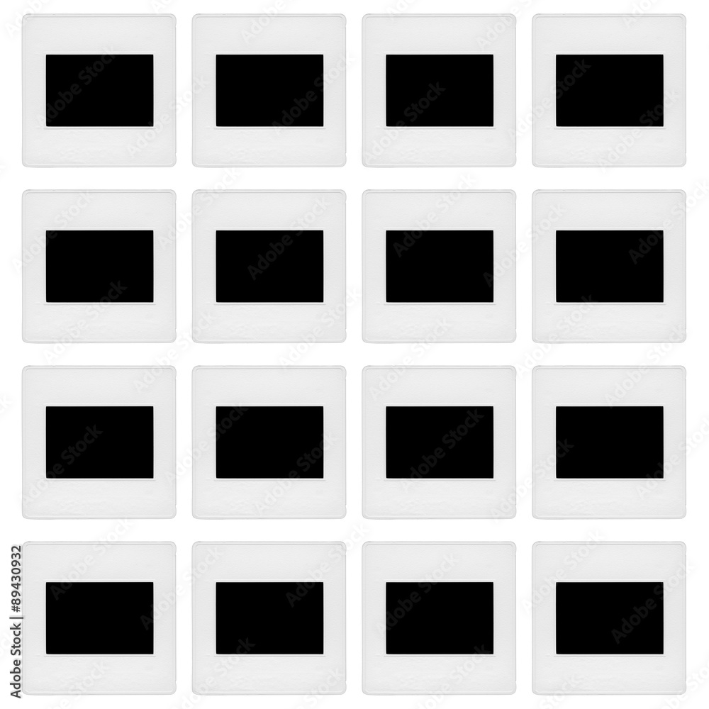 Sixteen 35mm slide mounts arranged in a 4x4 matrix as if on a light table, isolated on white. The frames are blacked out. Sixteen 35mm slide mounts arranged in a 4x4 matrix as if on a light table, isolated on white. The frames are blacked out.