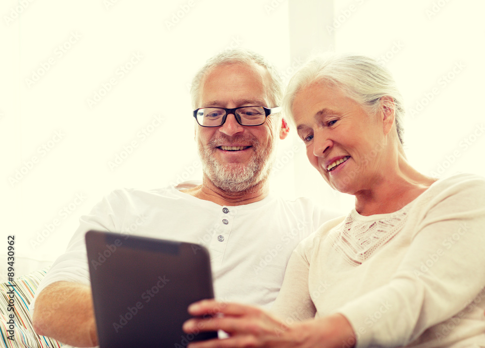 happy senior couple with tablet pc at home happy senior couple with tablet pc at home