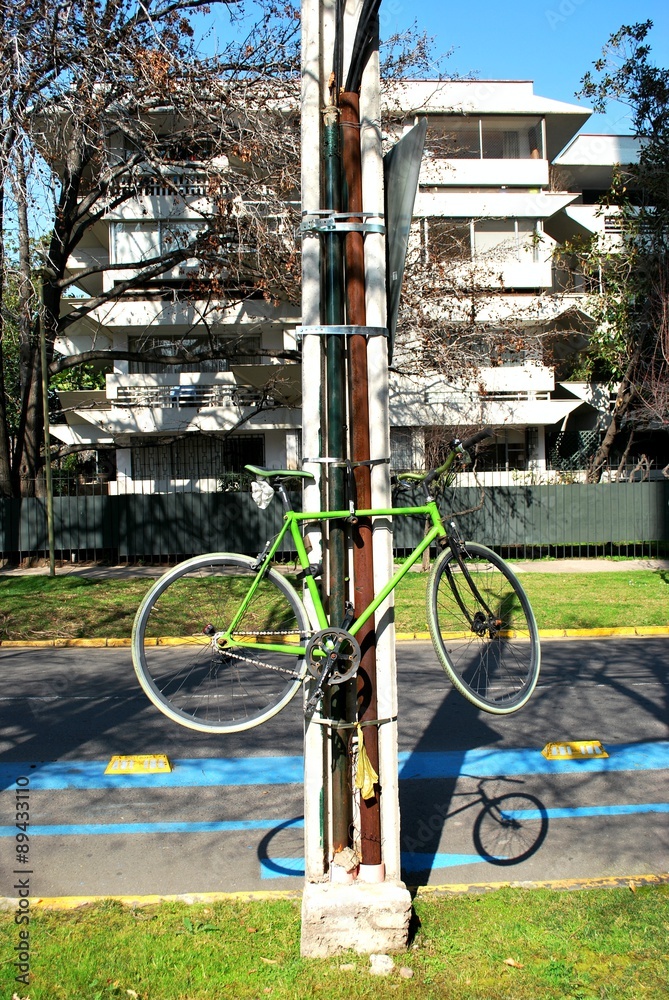 Fototapeta premium hanging bicycle at a street in Santiago, Chile