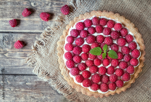 Billede på lærred Homemade traditional sweet raspberry tart pie with cream and
