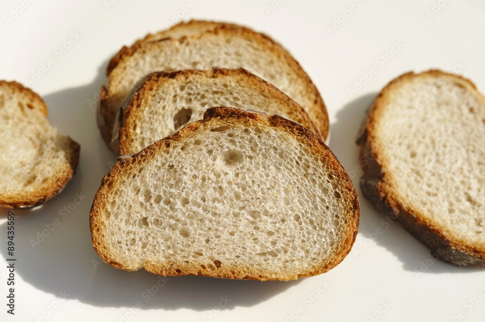 Five slices of wheat and rye baguette