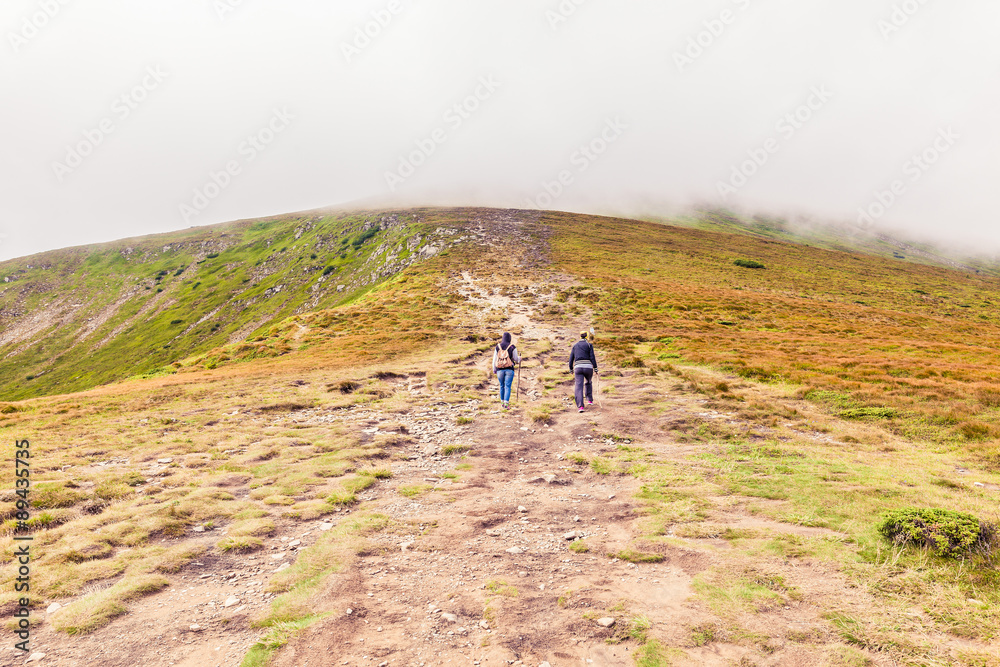 Tourists climb to the top of Hoverla