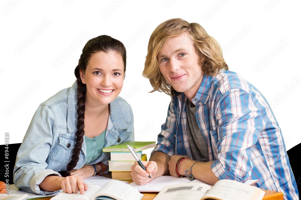 College students doing homework in library College students doing homework in library