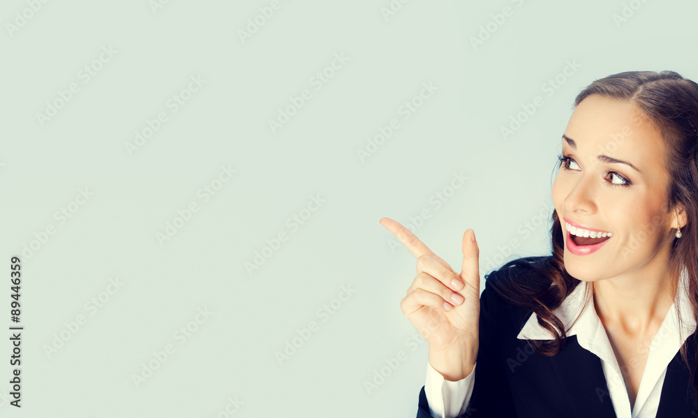 Businesswoman showing blank area for sign or copyspase Businesswoman showing blank area for sign or copyspase