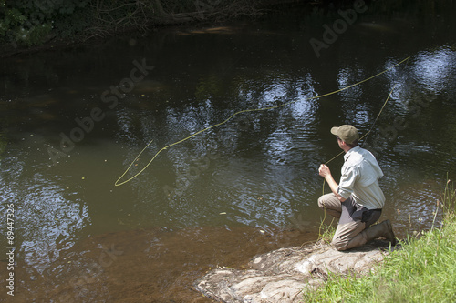 Man fly fishing on River Lyd Devon UK