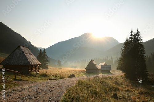 Fototapeta Naklejka Na Ścianę i Meble -  Huts along the trail in a valley surrounded by Carpathian Mountains, Poland