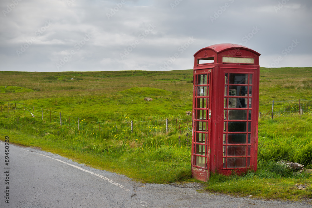 Red telephone booth in rural landscape, Skye, Scotland Red telephone booth in rural landscape, Skye, Scotland