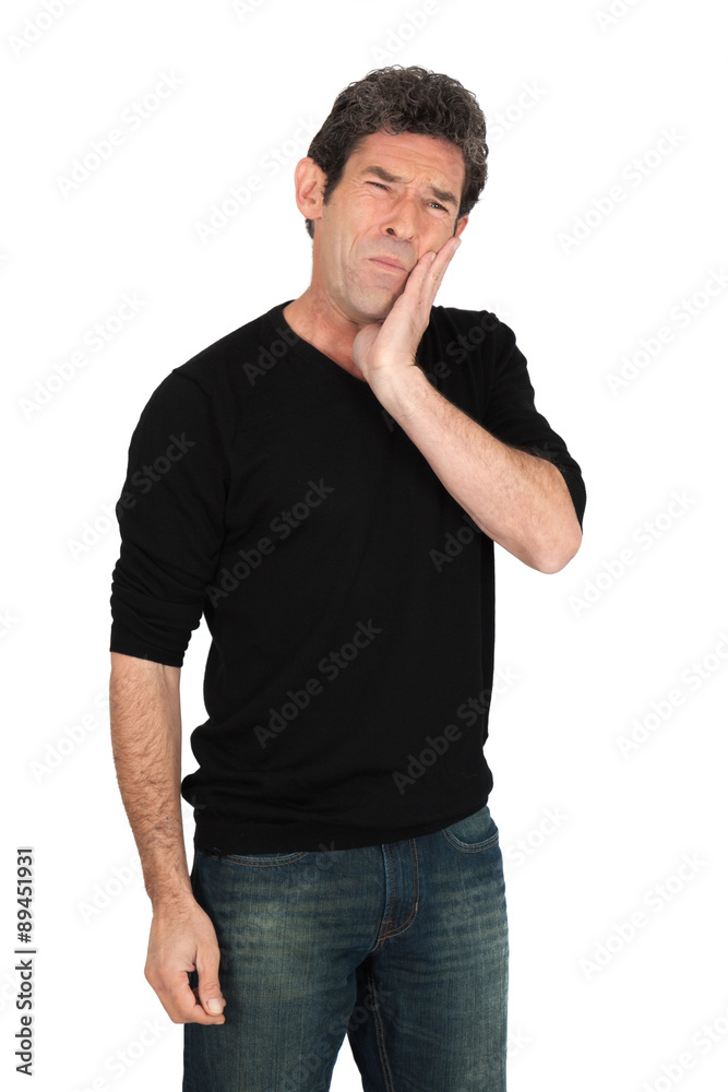 Handsome man doing different expressions in different sets of clothes: toothache Handsome man doing different expressions in different sets of clothes: toothache