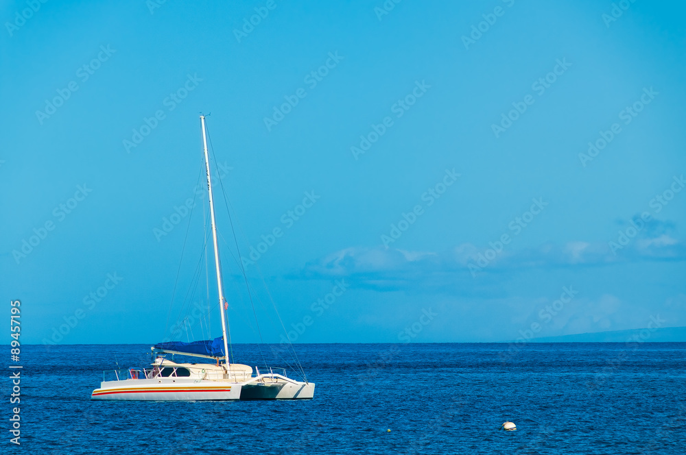 Catamaran moored in the Pacific Ocean off the island of Maui Haw