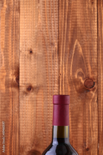 Wine bottle and wooden wall
