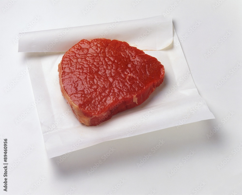 Beef fillet on white paper Beef fillet on white paper