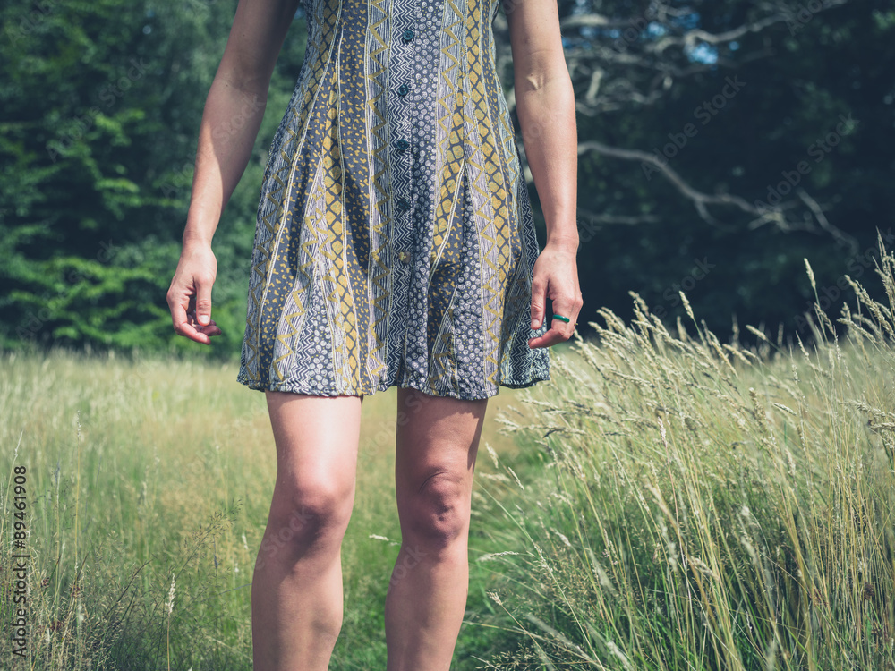 Young woman standing in meadow Young woman standing in meadow