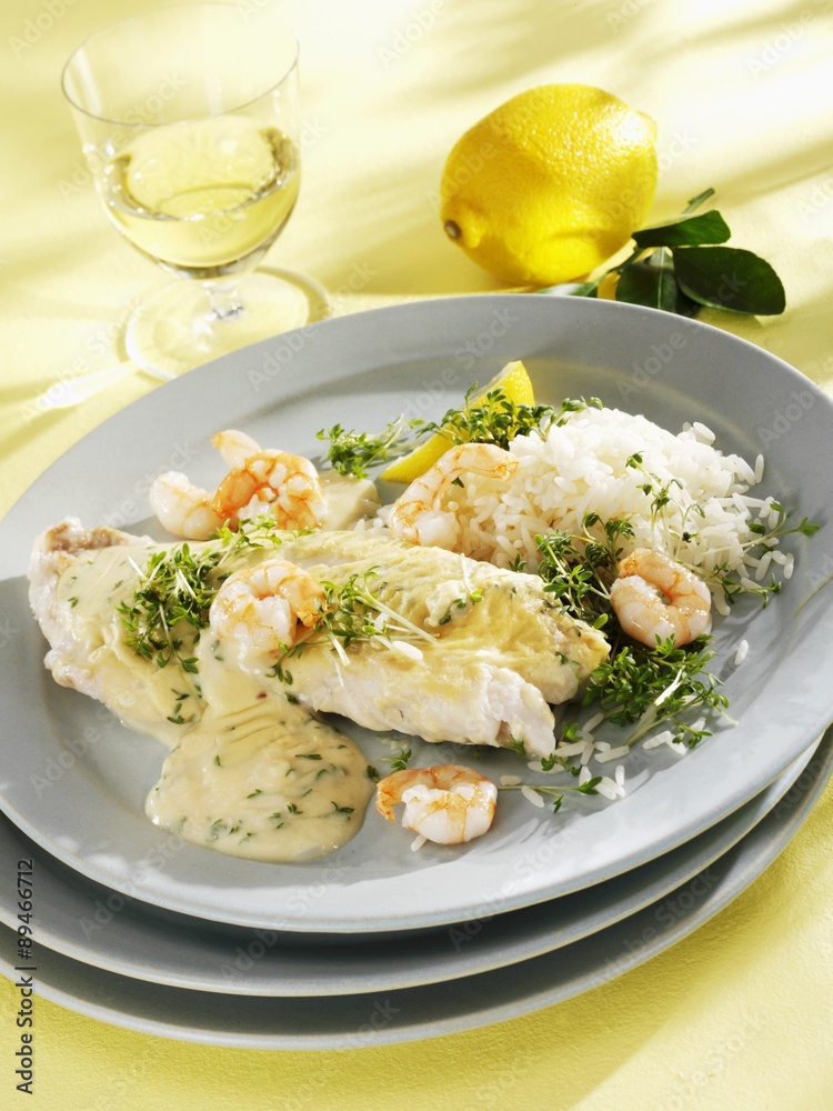 Coley and prawns with mustard sauce, cress and rice