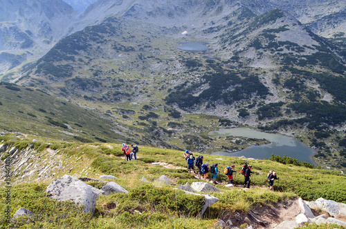 Group of Tourists High on a Mountain Slope