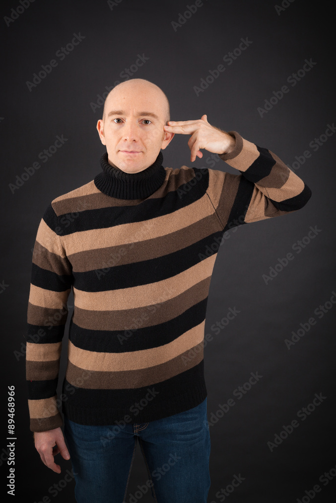 Handsome man doing different expressions in different sets of clothes: suicide Handsome man doing different expressions in different sets of clothes: suicide